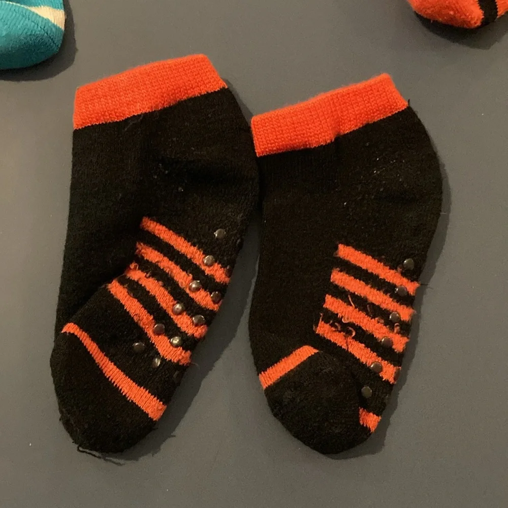 Toddler Boys socks with feet. EUC. Blue,red, yellow, black. 4 pairs